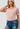 Pink Bodysuit with Sheer Polka Dot Sleeve - The Fashion Unicorn