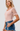 Pink Bodysuit with Sheer Polka Dot Sleeve - The Fashion Unicorn